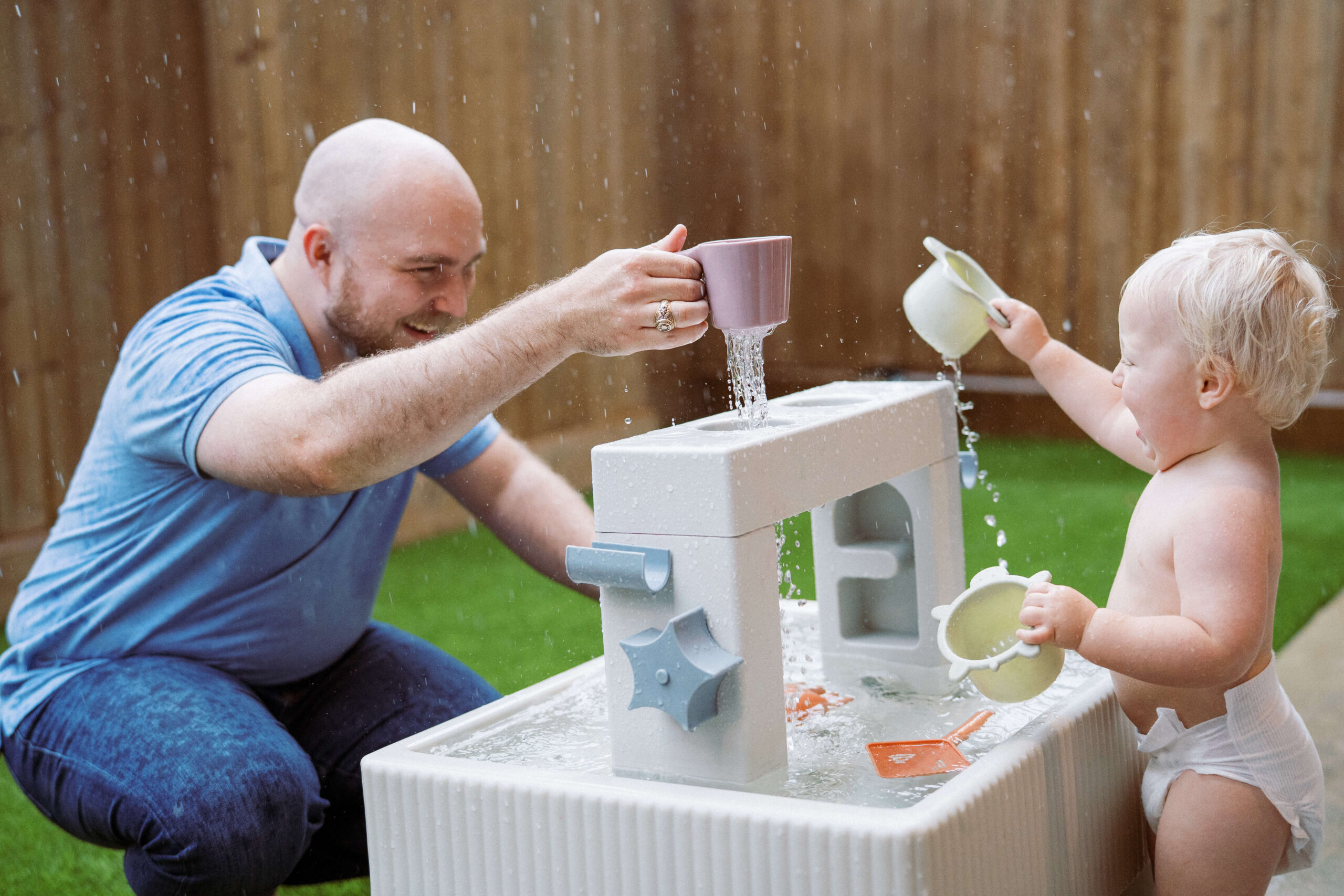 Houston film family photographer in home water table rain piano analog film Jameson family